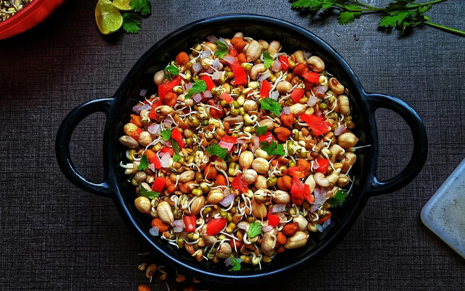 Sprouted moong and peanut chaat with tomato, onion and coriander